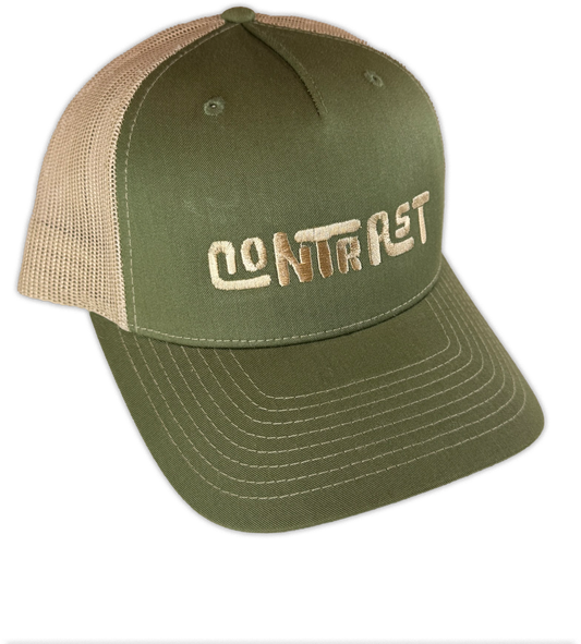 An olive green and beige trucker hat with 'CONTRAST' embroidered on the front panel, shown against a plain white background.