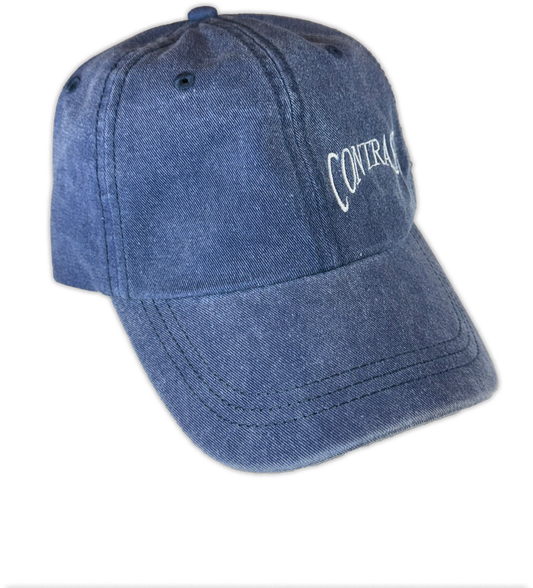 A washed blue denim baseball cap with white embroidered text reading 'CONTRAST' on the side, shown against a plain white background.