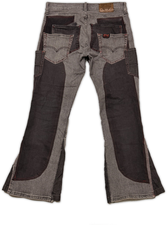 Gray denim flare jeans with dark brown leather patch panels on the front of the thighs and back pockets, shown from the back on a white background.