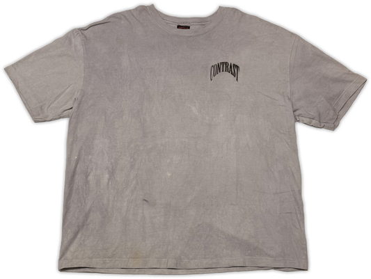 A faded light gray short-sleeve t-shirt with a black arched 'CONTRAST' logo printed on the left chest, laid flat against a white background.