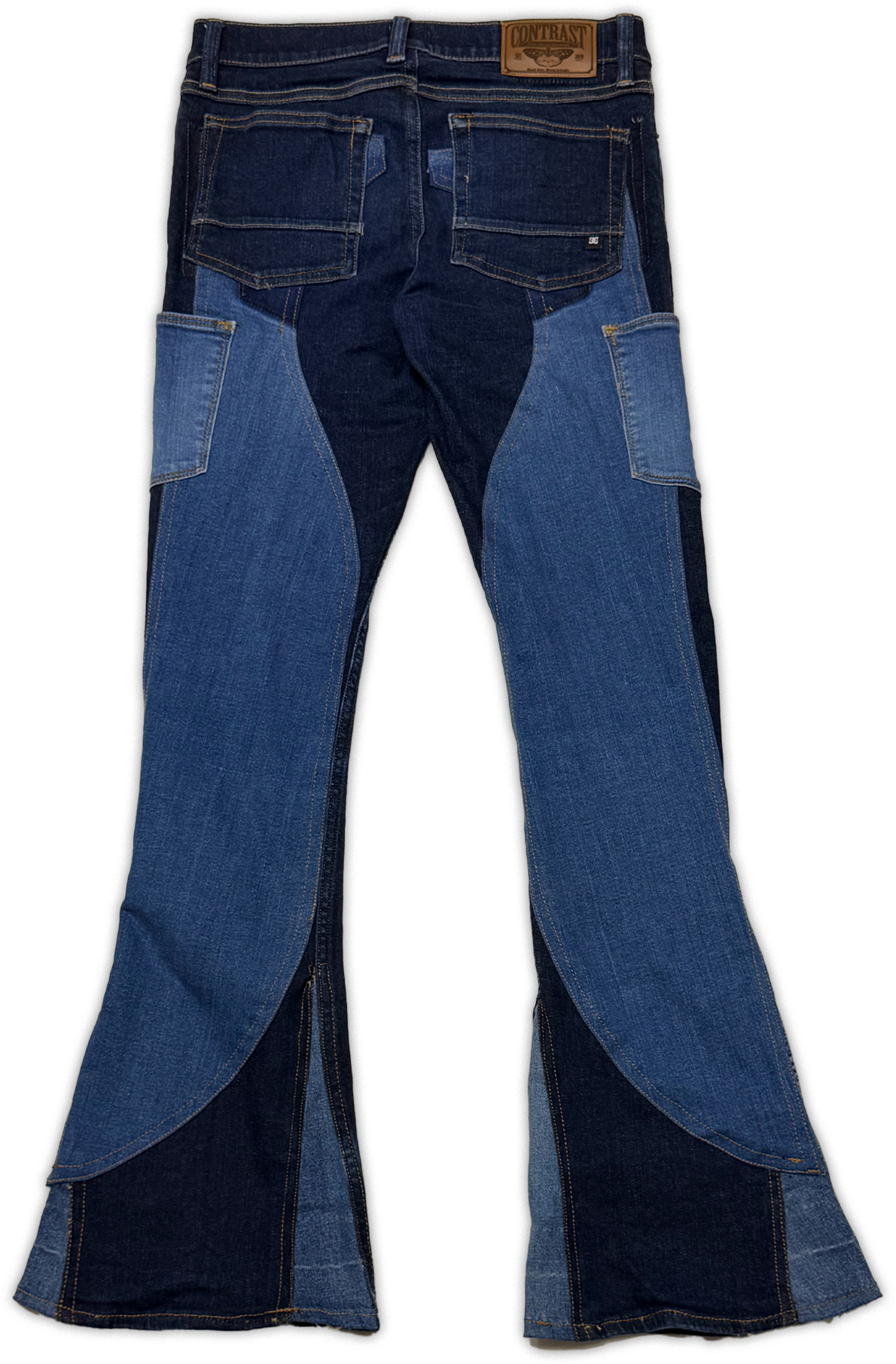 A pair of denim jeans with a unique patchwork design featuring dark blue and medium blue denim panels, photographed flat against a white background.