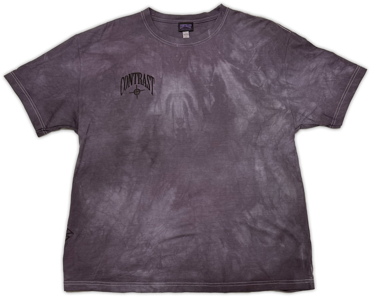 A short-sleeve crewneck t-shirt with a dark purple and gray mineral wash, featuring a black 'CONTRAST' graphic printed on the left chest.