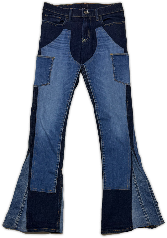 Blue patchwork denim flare jeans with dark indigo side panels and pocket details, shown flat against a white background.
