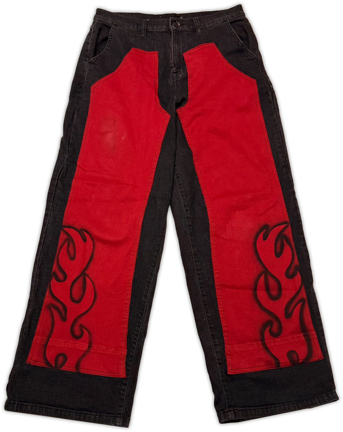 Red and black wide-leg pants with large red side panels and black flame-style embroidery on a white background.