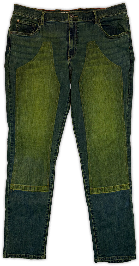 A pair of dark blue denim jeans with large olive green fabric panels sewn onto the front of each leg, photographed flat against a white background.