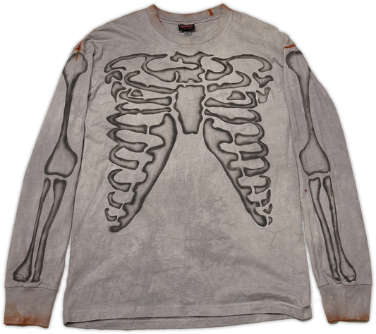A long-sleeve t-shirt in a washed, distressed gray fabric, featuring a large black rib cage graphic on the front and black skeletal arm prints on both sleeves.