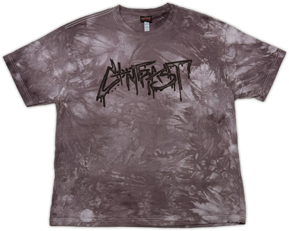 A short-sleeve crewneck t-shirt featuring a mottled, mineral-washed tie-dye pattern in dark gray and brownish tones, with a black 'contrast' band logo printed across the chest.