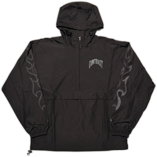 A black hooded windbreaker jacket with a half-zip front, featuring a white arched 'CONTRAST' logo on the left chest and gray flame graphics on both sleeves, shown flat against a white background.