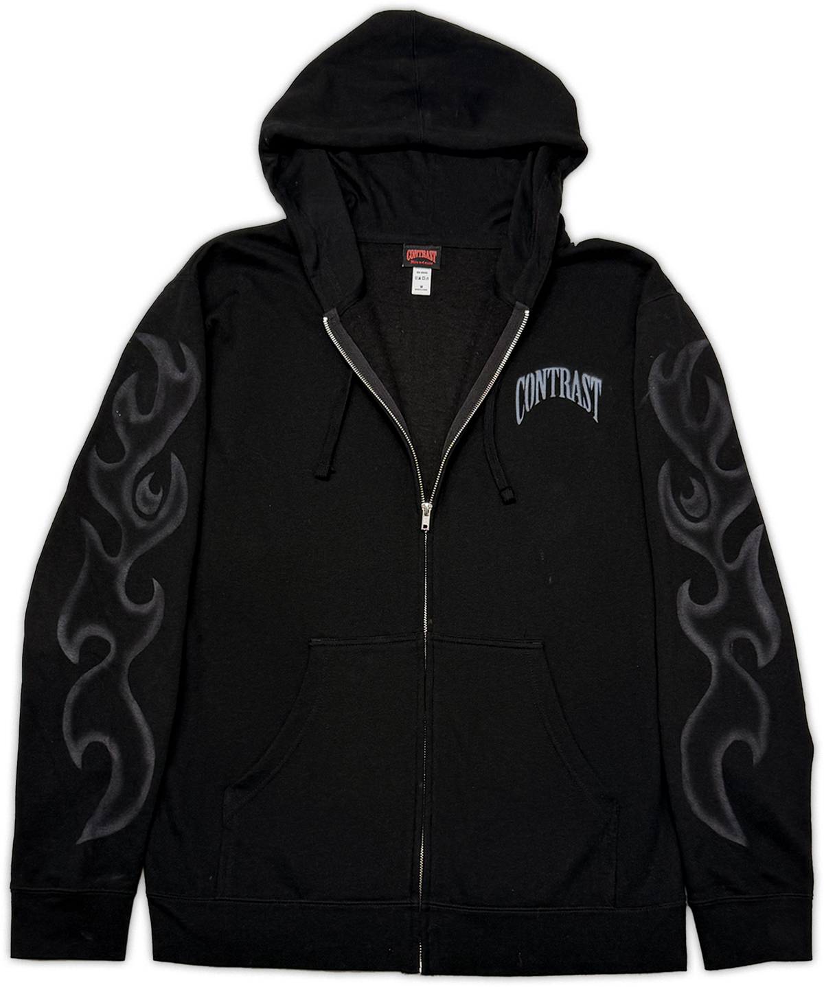 A black zip-up hoodie with a gray flame graphic on both sleeves and the word 'CONTRAST' printed in gray on the left chest, shown against a plain white background.