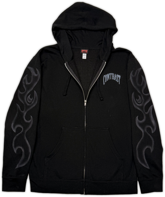 A black zip-up hoodie with a gray flame graphic on both sleeves and the word 'CONTRAST' printed in gray on the left chest, shown against a plain white background.